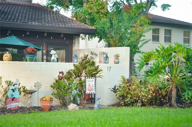 a view of a house with a yard and plants