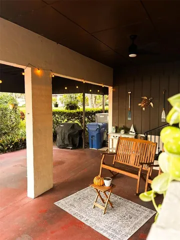 a outdoor living space with furniture and a rug