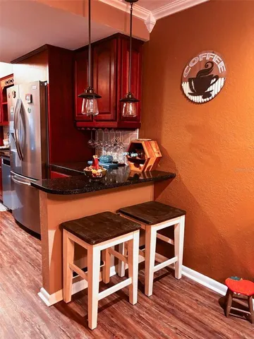 a room with wooden floor and a chair