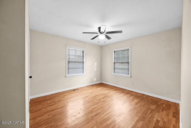 3023 Christmasville Road Jackson, TN 38305 - Photo 12 of 20 a view of empty room with wooden floor and fan