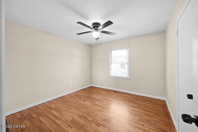 3023 Christmasville Road Jackson, TN 38305 - Photo 13 of 20 a view of an empty room with window and wooden floor