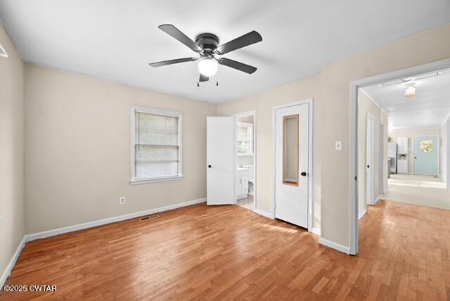 3023 Christmasville Road Jackson, TN 38305 - Photo 15 of 20 a view of a livingroom with a ceiling fan and wooden floor