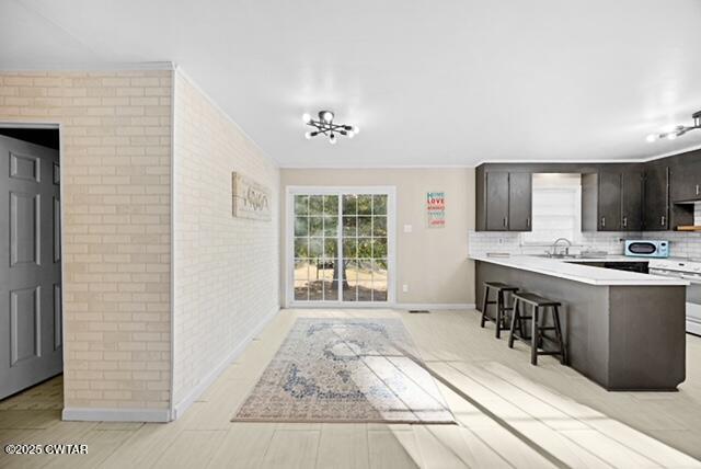 3023 Christmasville Road Jackson, TN 38305 - Photo 9 of 20 a living room with stainless steel appliances kitchen island granite countertop a refrigerator stove a sink and dishwasher with wooden floor