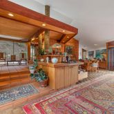 a room with lots of furniture and a rug