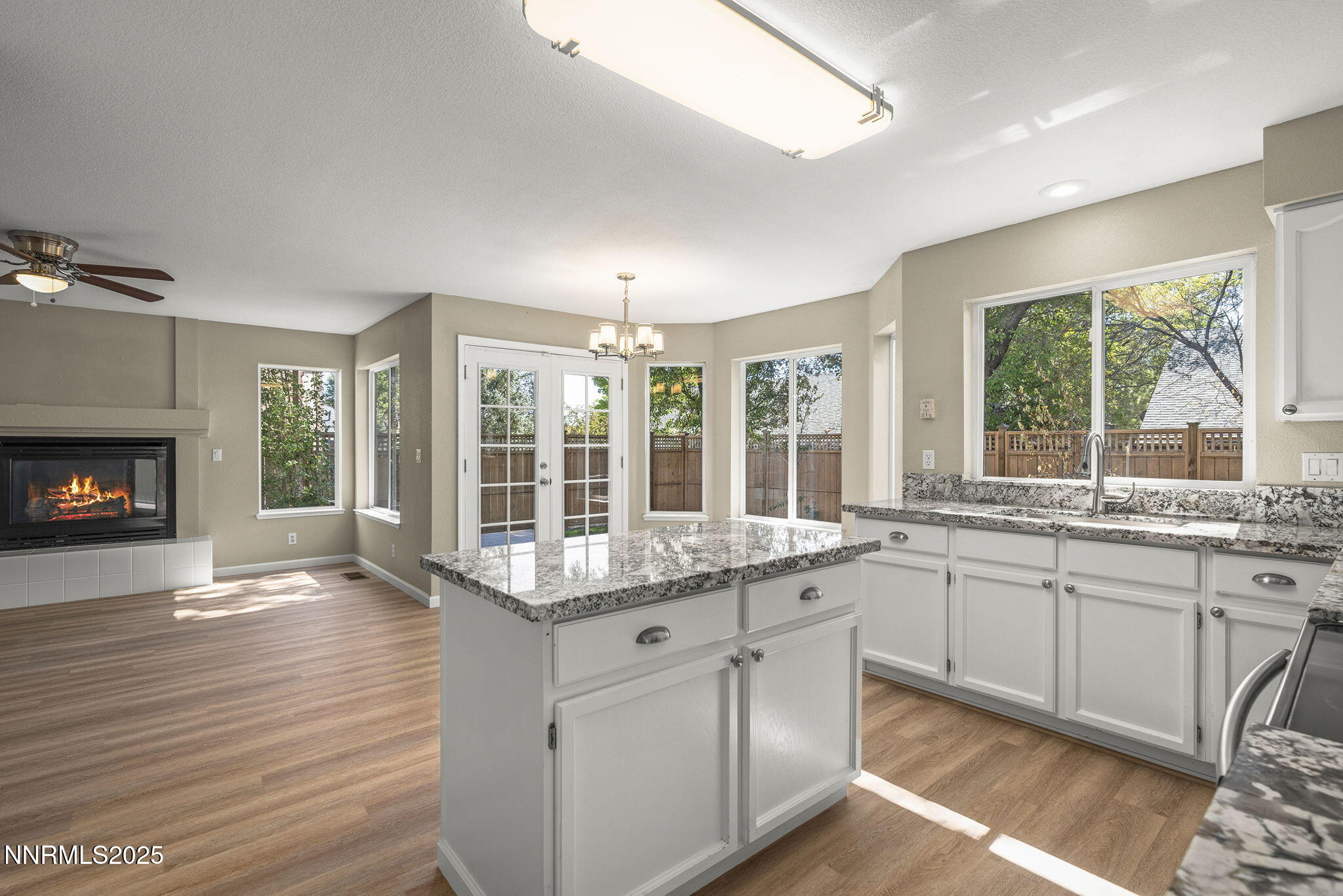 5830 Blue Horizon Drive Reno, NV 89523 - Photo 18 of 41 a kitchen with granite countertop a stove a sink and wooden floor