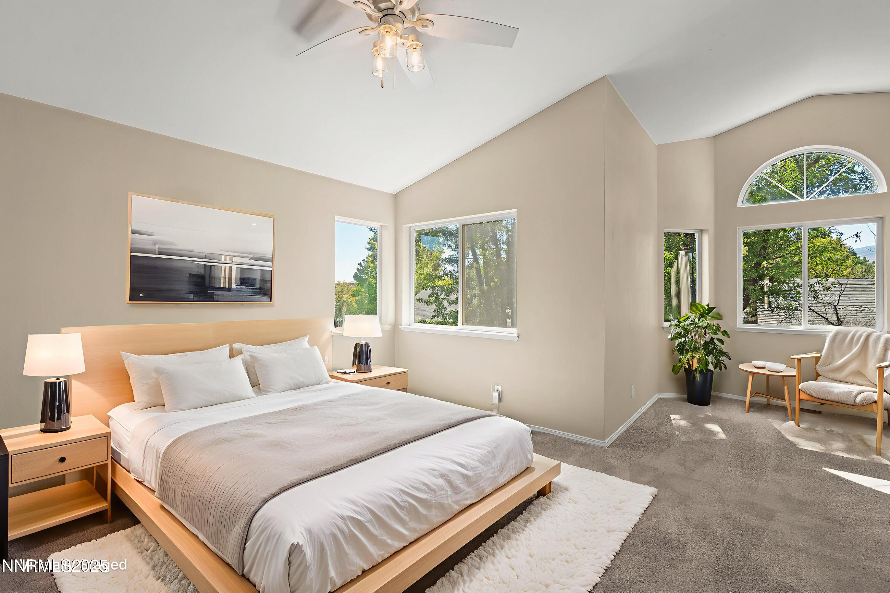 5830 Blue Horizon Drive Reno, NV 89523 - Photo 23 of 41 a bedroom with a large bed and a chandelier