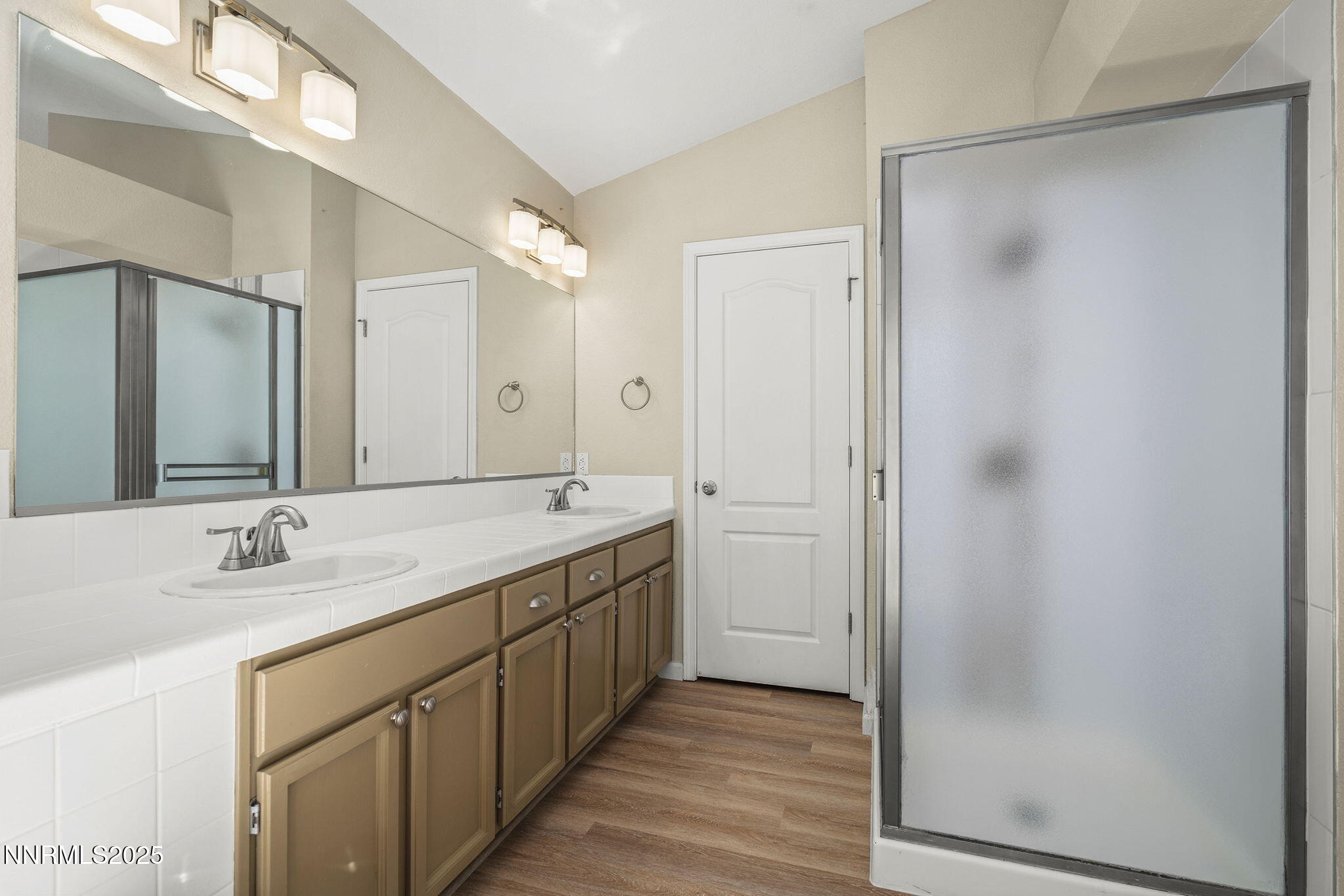 5830 Blue Horizon Drive Reno, NV 89523 - Photo 28 of 41 a bathroom with a double vanity sink and a mirror