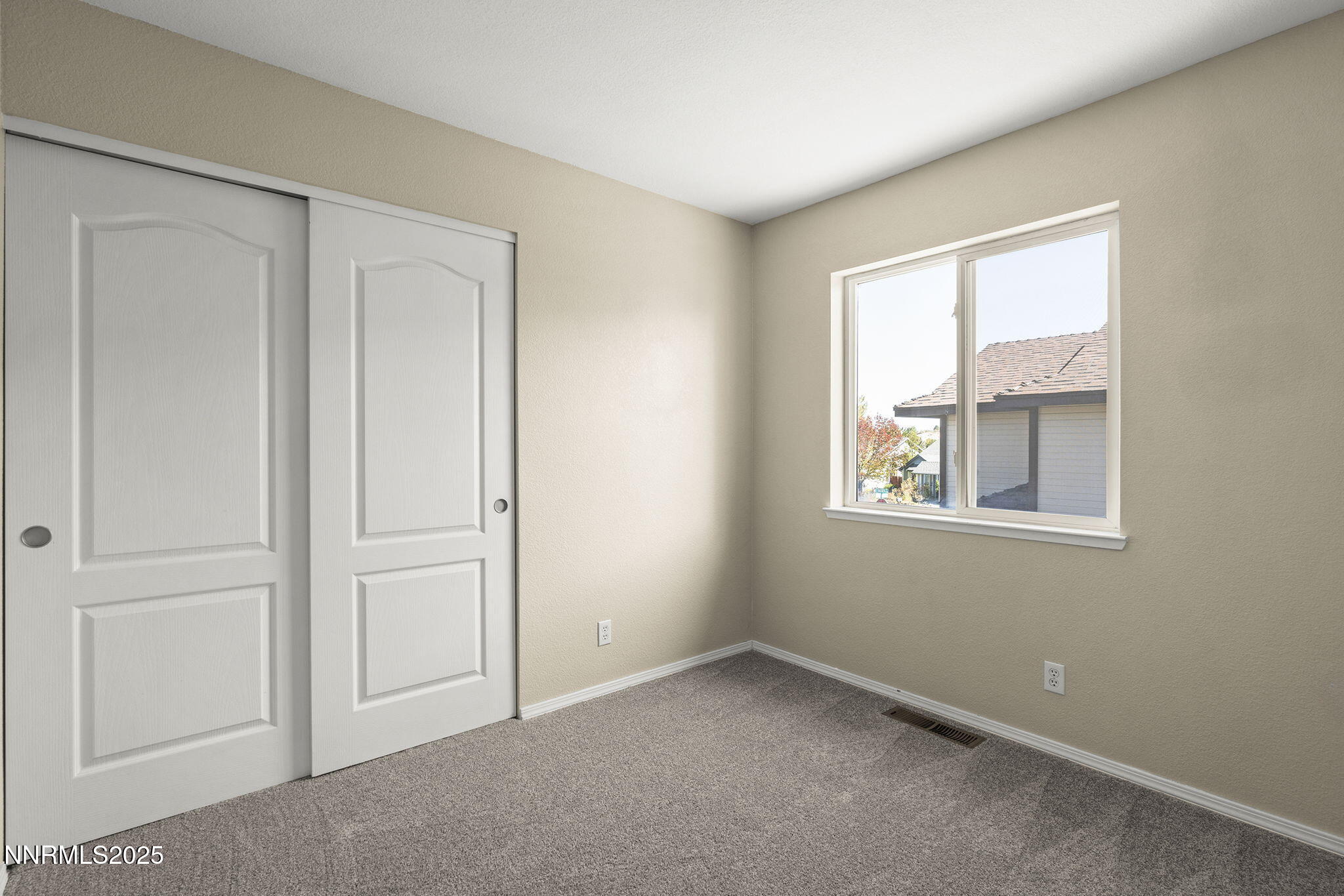 5830 Blue Horizon Drive Reno, NV 89523 - Photo 29 of 41 an empty room with windows and closet