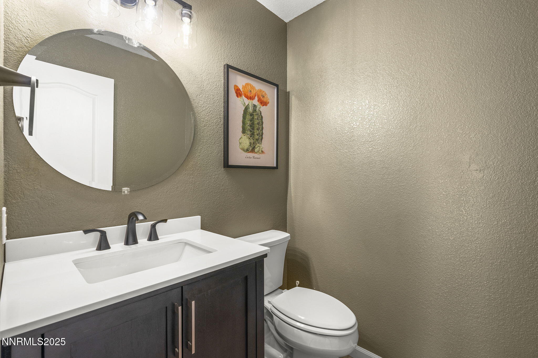 5830 Blue Horizon Drive Reno, NV 89523 - Photo 33 of 41 a bathroom with a toilet a sink and mirror