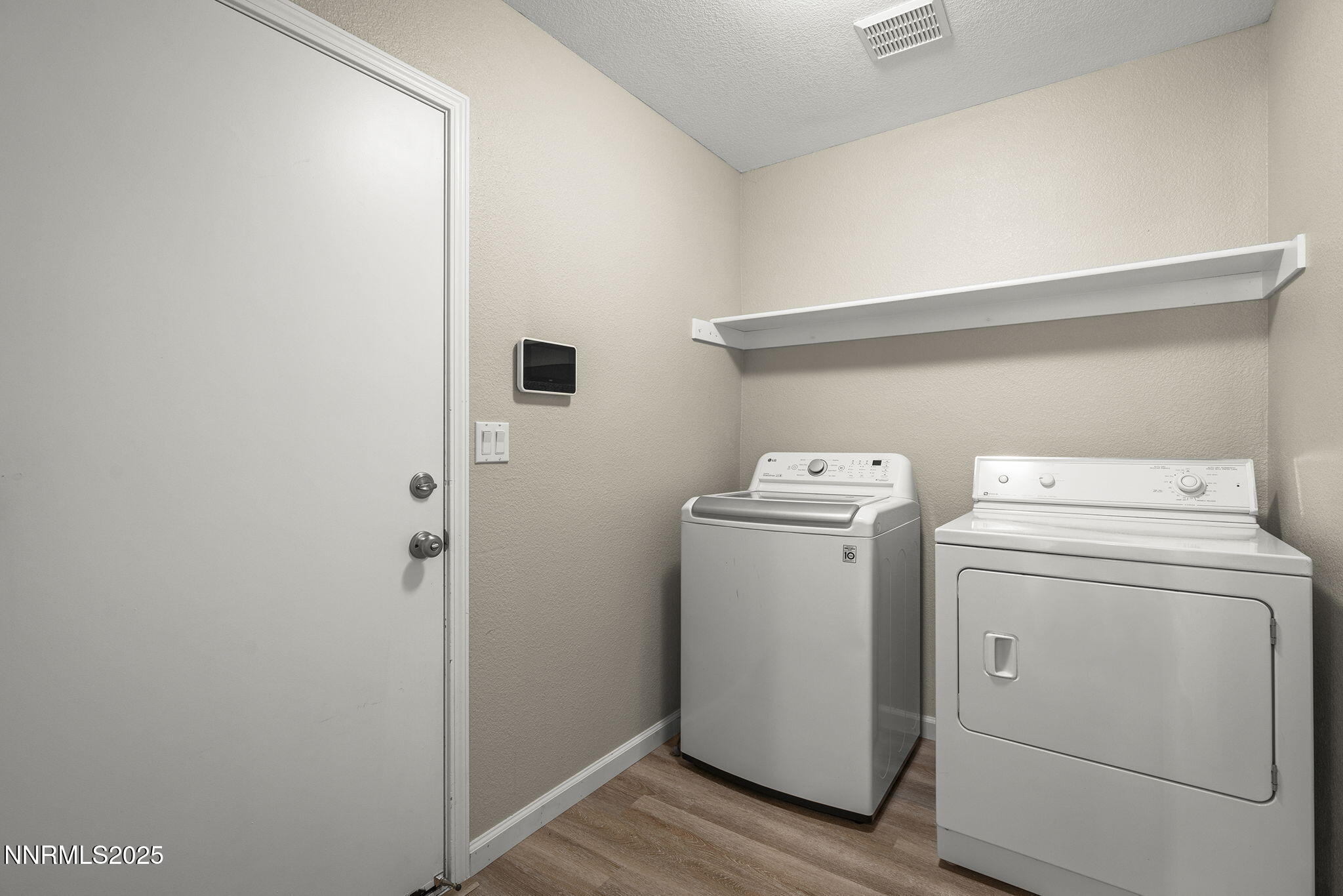 5830 Blue Horizon Drive Reno, NV 89523 - Photo 34 of 41 a utility room with dryer and washer