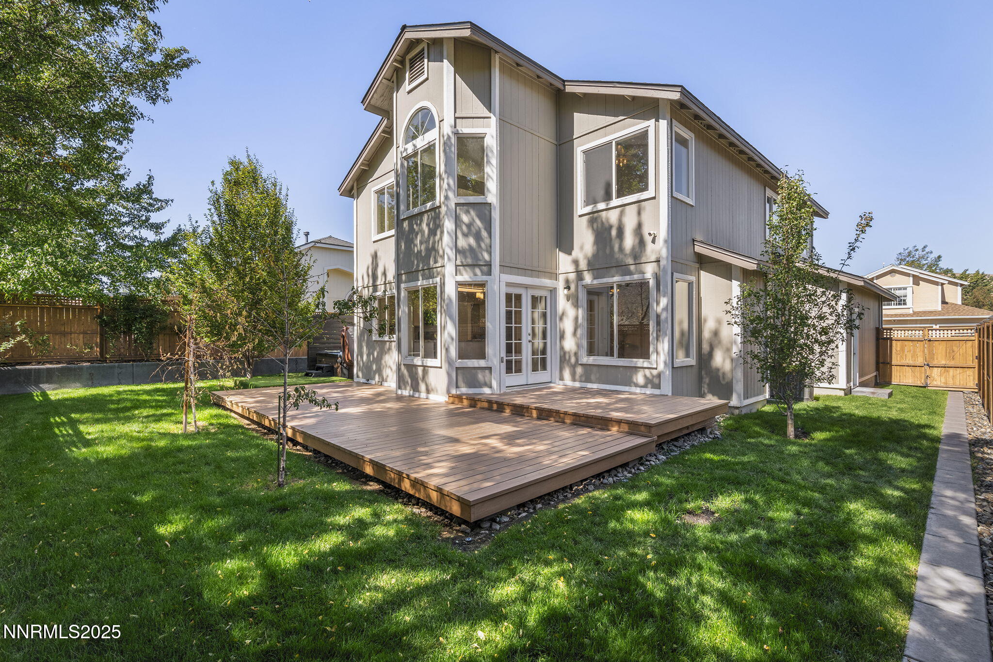 5830 Blue Horizon Drive Reno, NV 89523 - Photo 37 of 41 a view of a house with a backyard and a tree