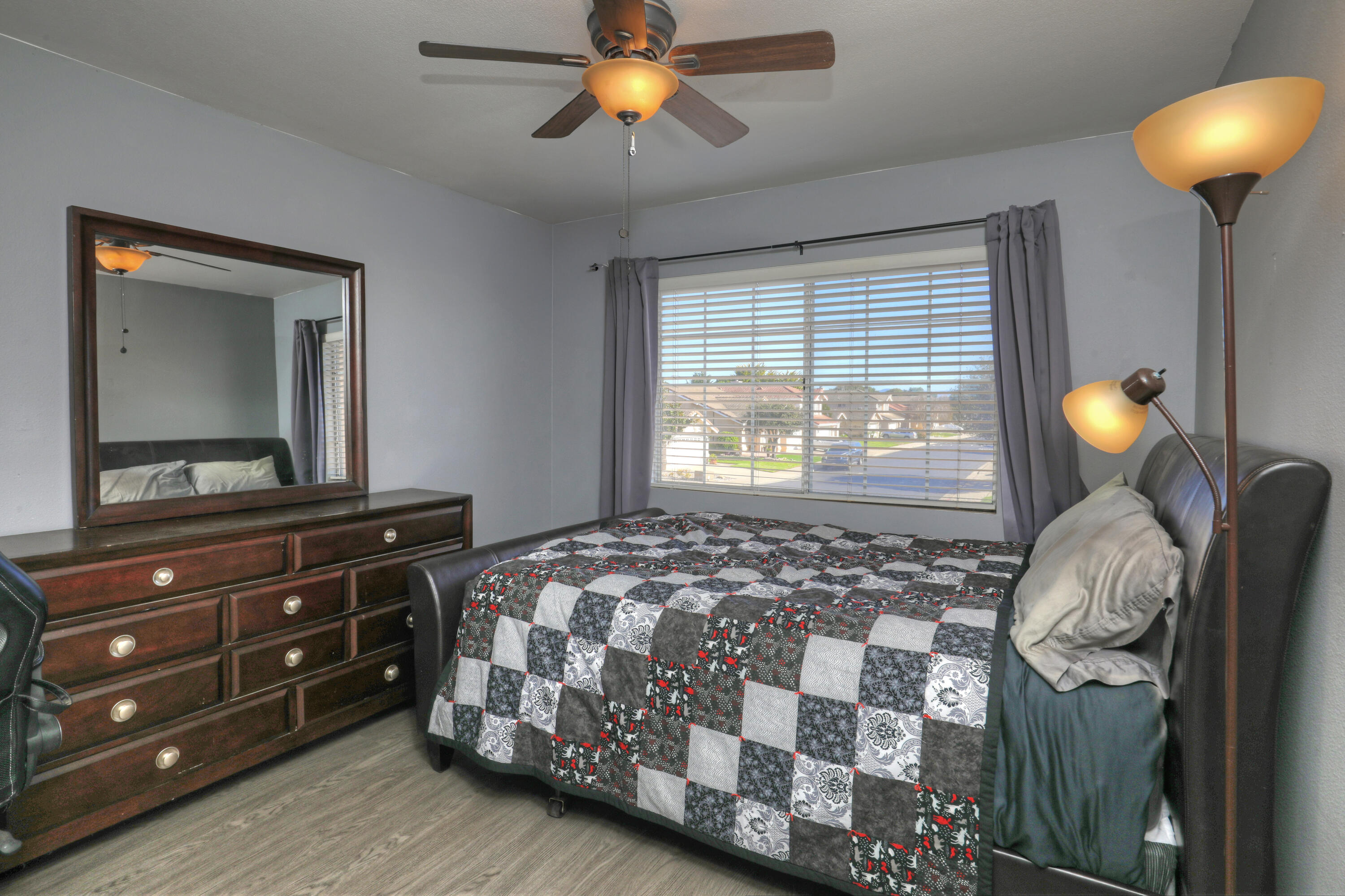 1337 Westbrook Drive Lompoc, CA 93436 - Photo 13 of 28 a bedroom with a bed and a chandelier