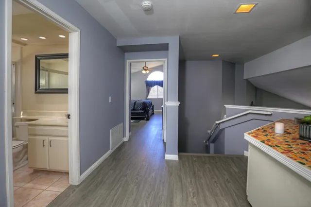 a view of a kitchen cabinets and a wooden floor
