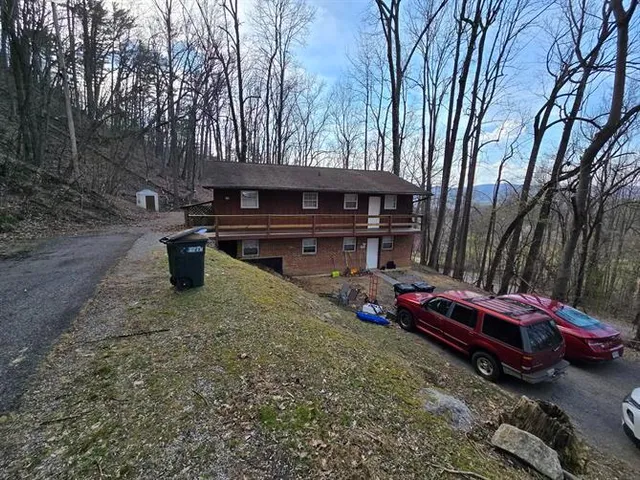 a backyard of a house with fire pit and outdoor space