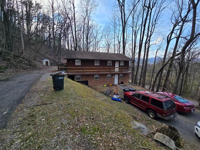 a backyard of a house with fire pit and outdoor space