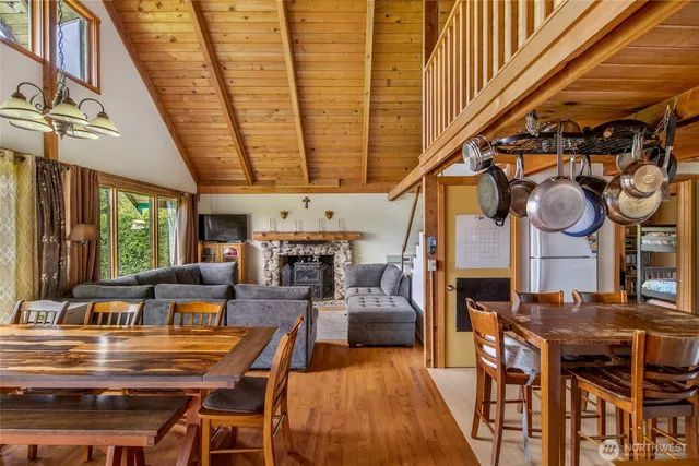 a living room with lots of furniture and kitchen view