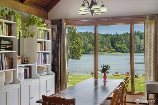 a view of a dining room with furniture window and outside view