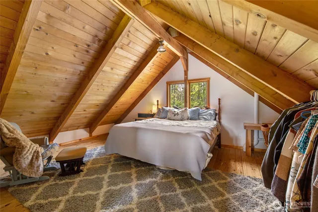 a view of living room with furniture and a rug