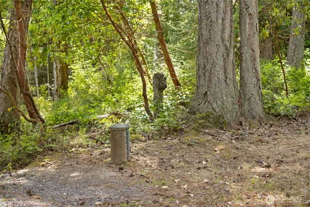 a wooden fence with a small yard
