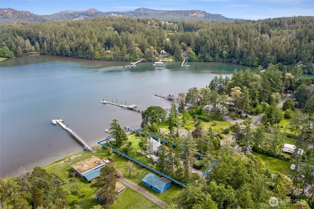 an aerial view of a house with a lake view