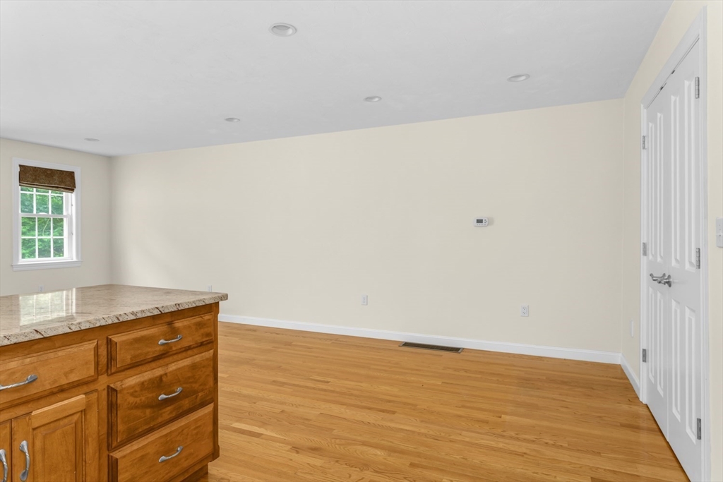 49 Beaver Street, Unit 49 Franklin, MA 02038 - Photo 10 of 46 a room with cabinets and wooden floor