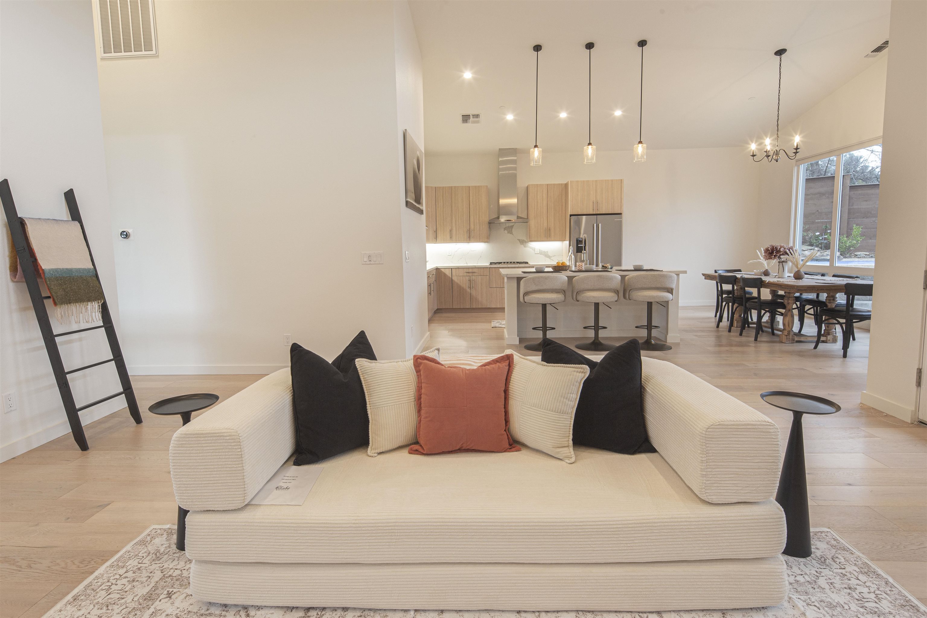 18870 Old Bridge Road Jamestown, CA 95327 - Photo 12 of 57 Living room featuring light wood-style floors, high vaulted ceiling, and a chandelier