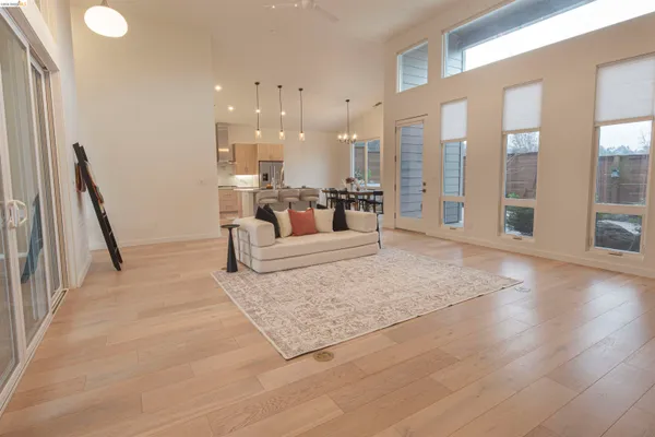 a open kitchen with a sink and living room