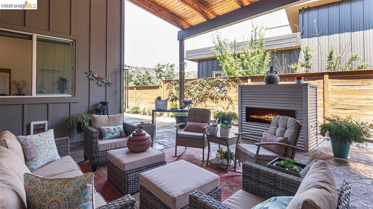18870 Old Bridge Road Jamestown, CA 95327 - Photo 18 of 57 a outdoor living space with furniture and a fireplace