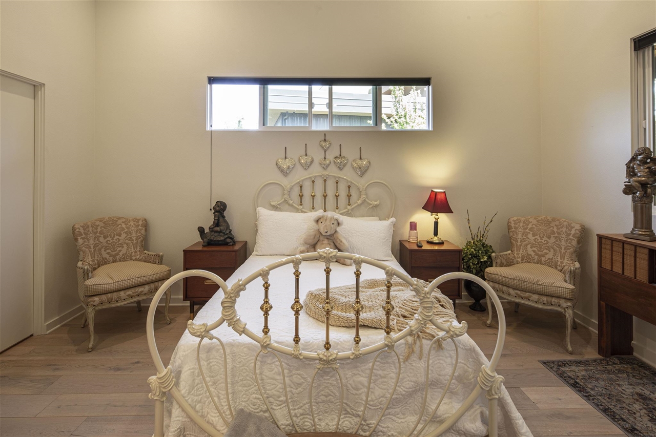 18870 Old Bridge Road Jamestown, CA 95327 - Photo 21 of 57 Bedroom with high vaulted ceiling and light hardwood / wood-style floors