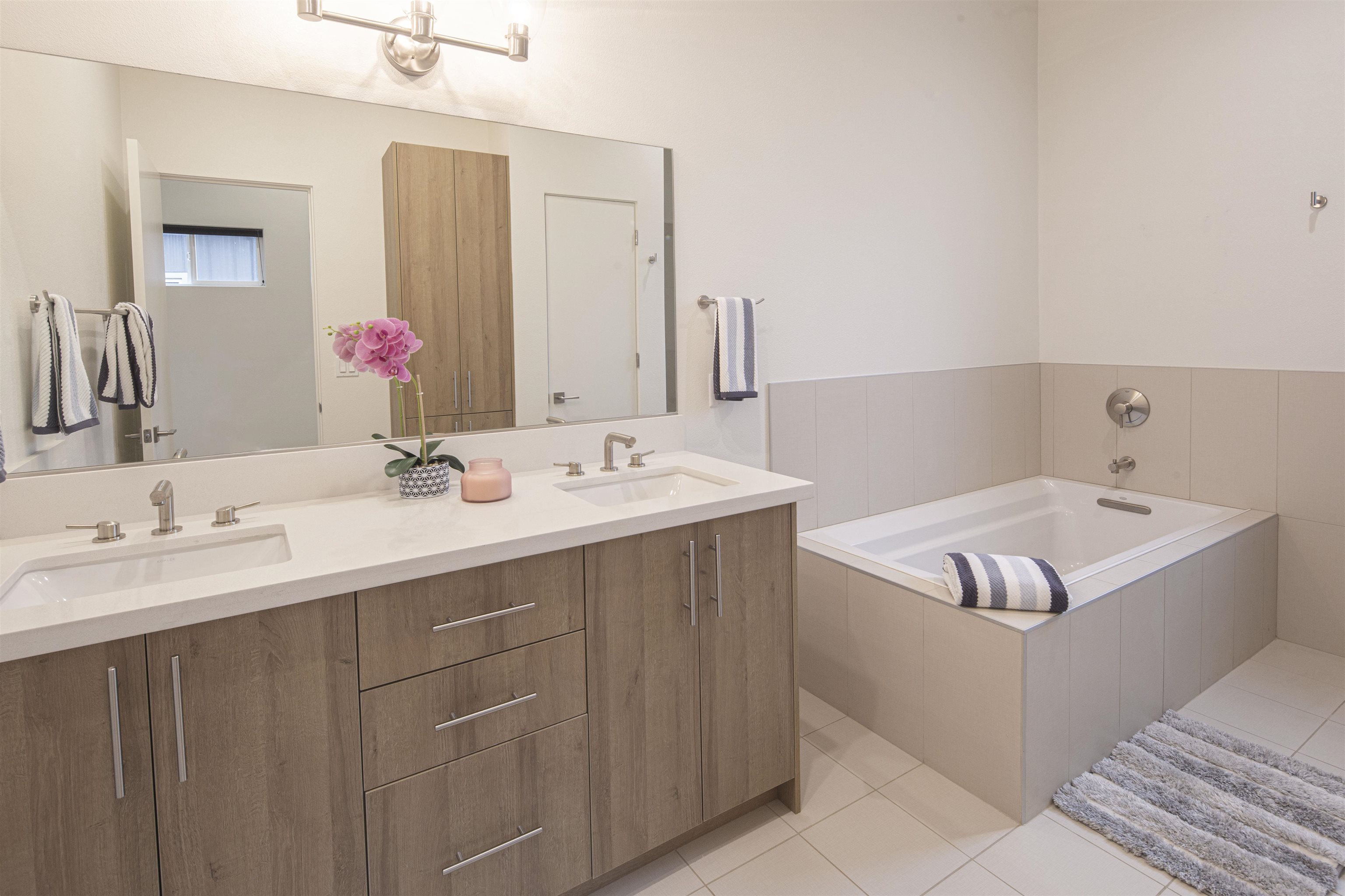 18870 Old Bridge Road Jamestown, CA 95327 - Photo 23 of 57 Full bathroom with double vanity, a bath, and light tile patterned floors