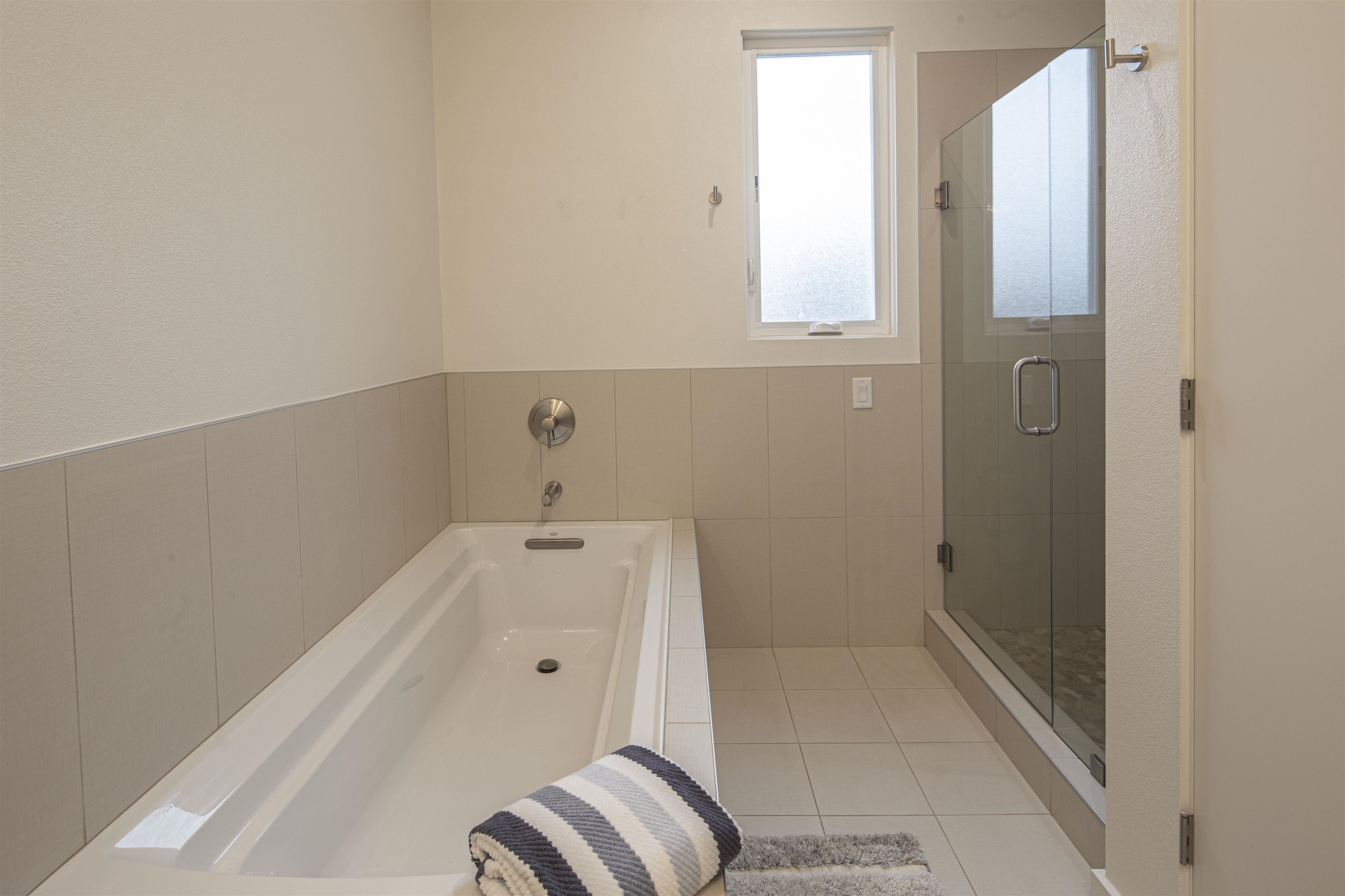 18870 Old Bridge Road Jamestown, CA 95327 - Photo 24 of 57 Full bath featuring a shower stall, a bath, and light tile patterned floors