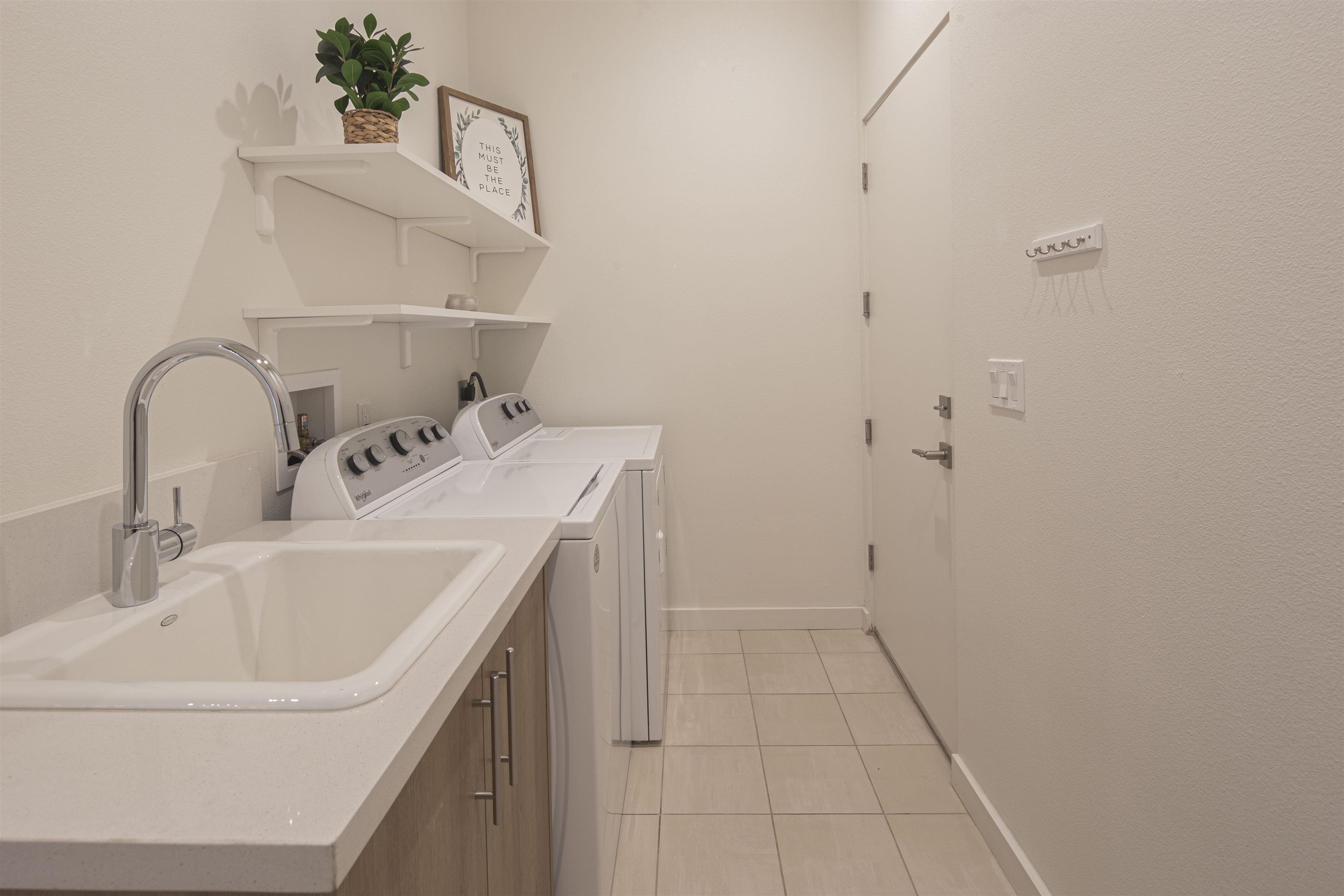 18870 Old Bridge Road Jamestown, CA 95327 - Photo 34 of 57 Washroom featuring washing machine and dryer, cabinet space, and light tile patterned floors