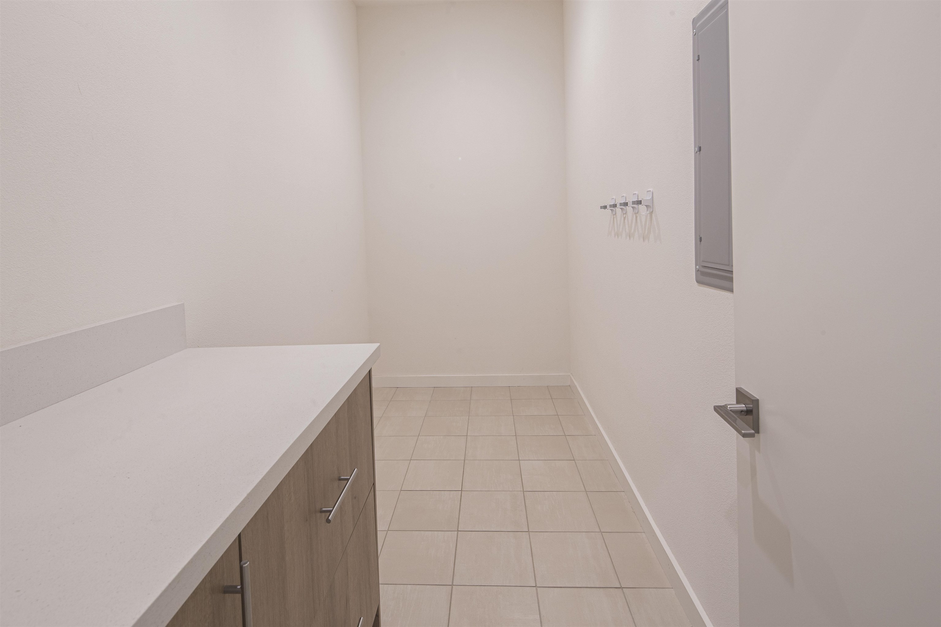 18870 Old Bridge Road Jamestown, CA 95327 - Photo 35 of 57 Laundry room with light tile patterned floors and electric panel