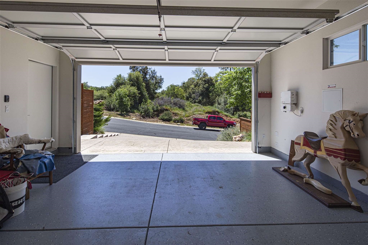 18870 Old Bridge Road Jamestown, CA 95327 - Photo 37 of 57 Garage featuring a garage door opener