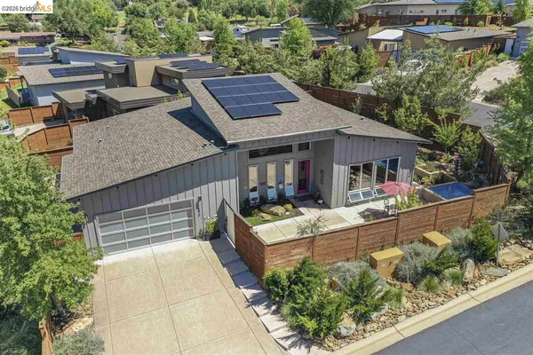 an aerial view of a house with a garden