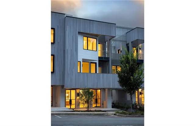 a view of a brick house with a large windows