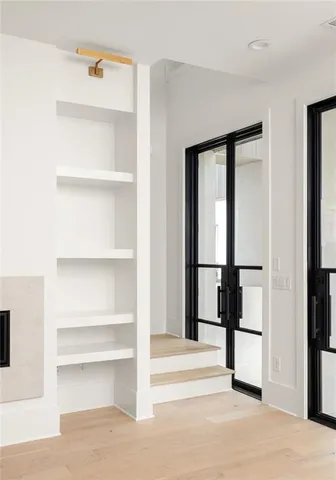 a view of staircase with white walls and a window