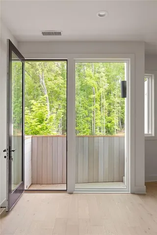 a view of a back yard from a room