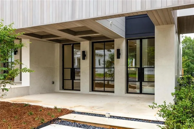 a view of a house with a window and wooden walls