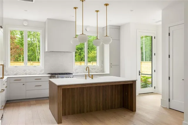 a kitchen with a sink and window