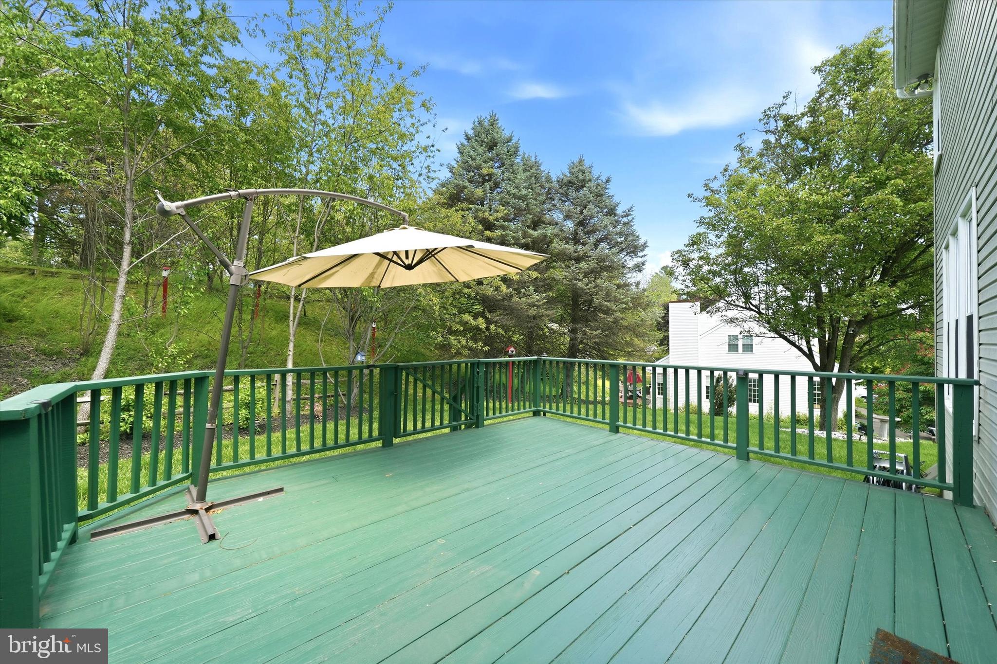100 Cambridge Road Landenberg, PA 19350 - Photo 34 of 37 a view of a deck with a large trees and wooden fence