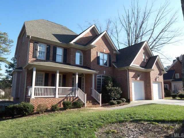 7904 Ridge Pointe Lane Raleigh, NC 27615 - Photo 1 of 11 a front view of a house with garden