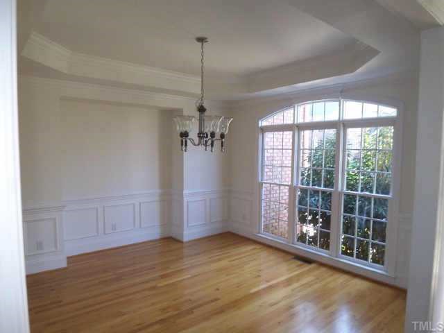 7904 Ridge Pointe Lane Raleigh, NC 27615 - Photo 5 of 11 a view of empty room with wooden floor and fan