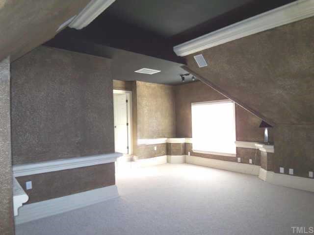 7904 Ridge Pointe Lane Raleigh, NC 27615 - Photo 8 of 11 a view of empty room with a fireplace