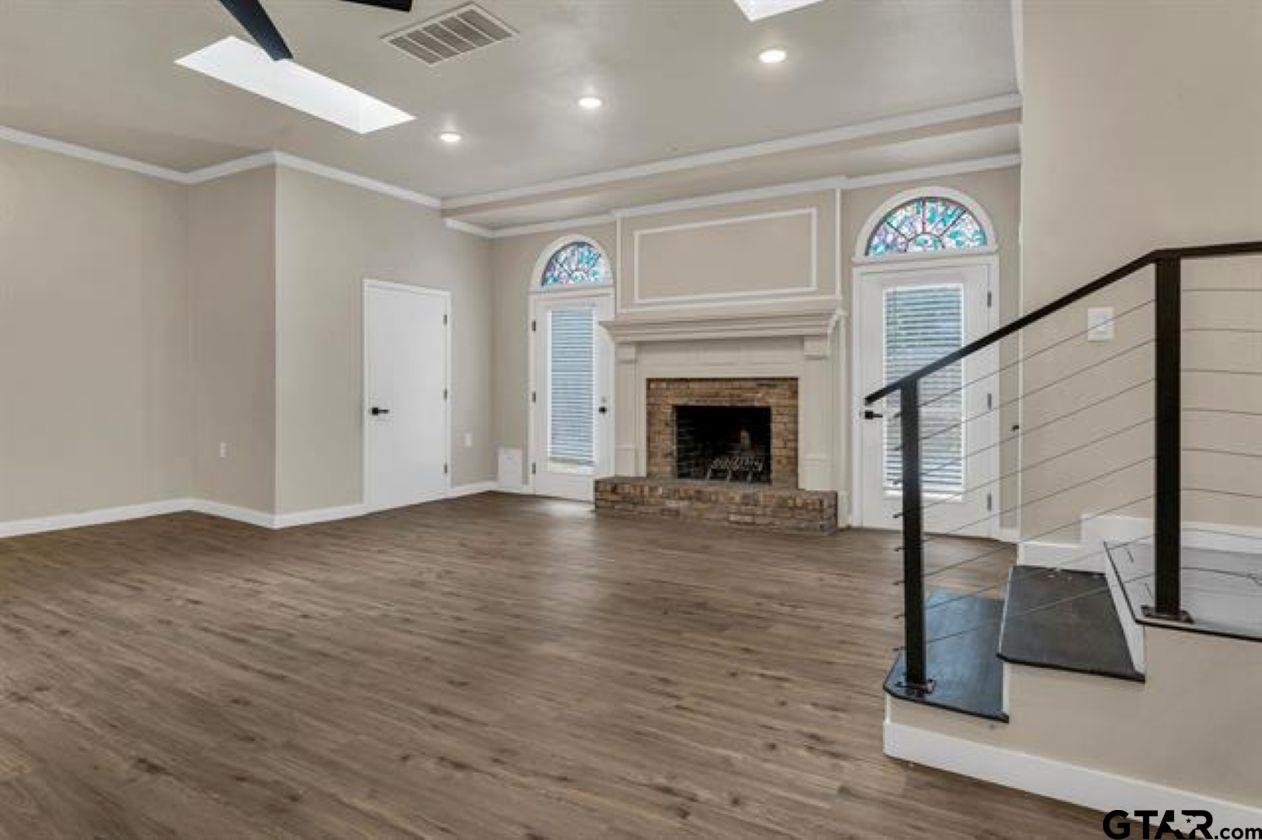 2425 Oak Lane Tyler, TX 75701 - Photo 18 of 33 a view of entryway and hall with wooden floor