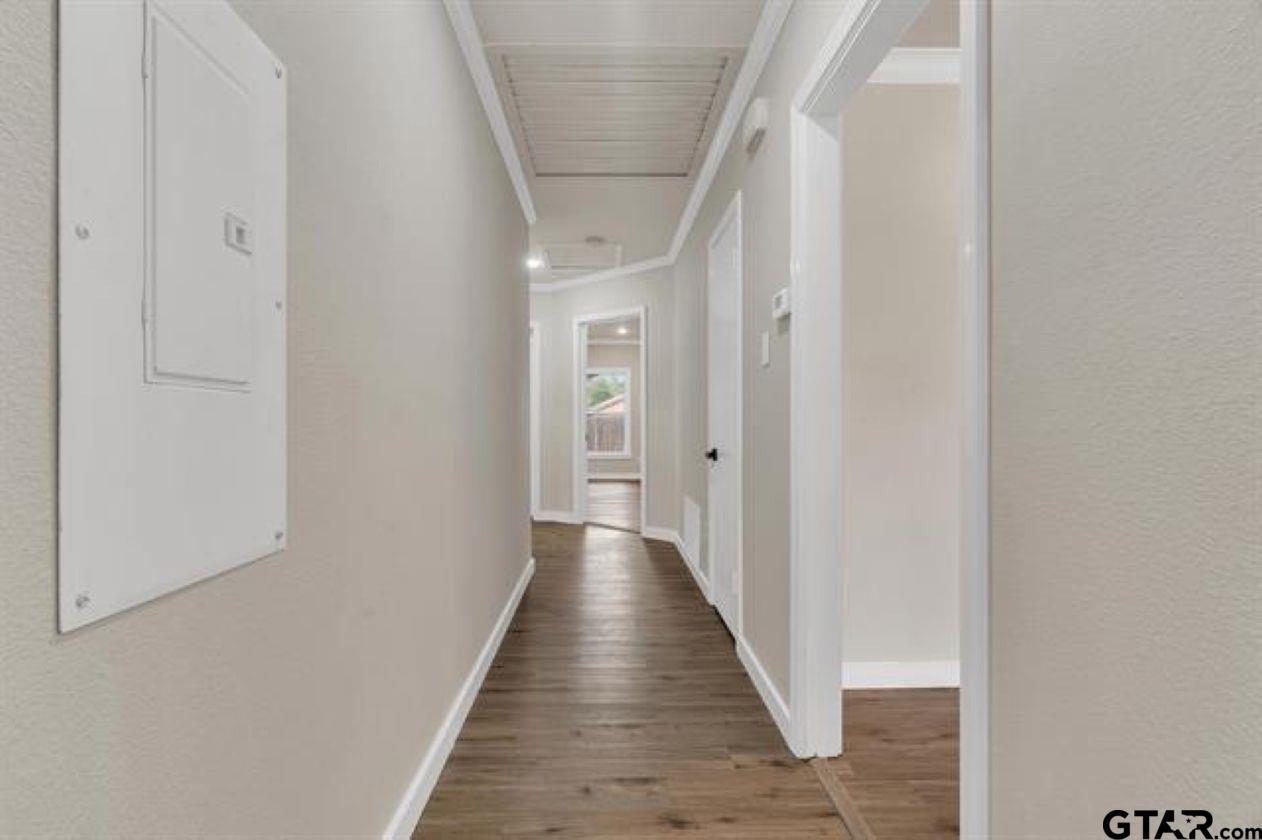 2425 Oak Lane Tyler, TX 75701 - Photo 25 of 33 a view of a hallway with wooden floor