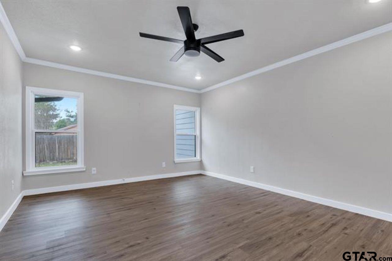 2425 Oak Lane Tyler, TX 75701 - Photo 26 of 33 a view of wooden floor and a chandelier fan in a room