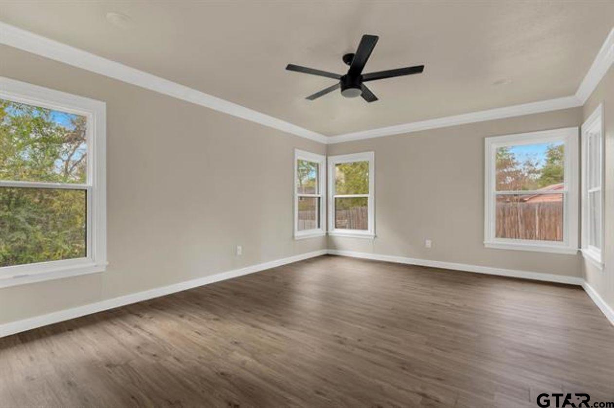 2425 Oak Lane Tyler, TX 75701 - Photo 29 of 33 a view of a big room with wooden floor and windows