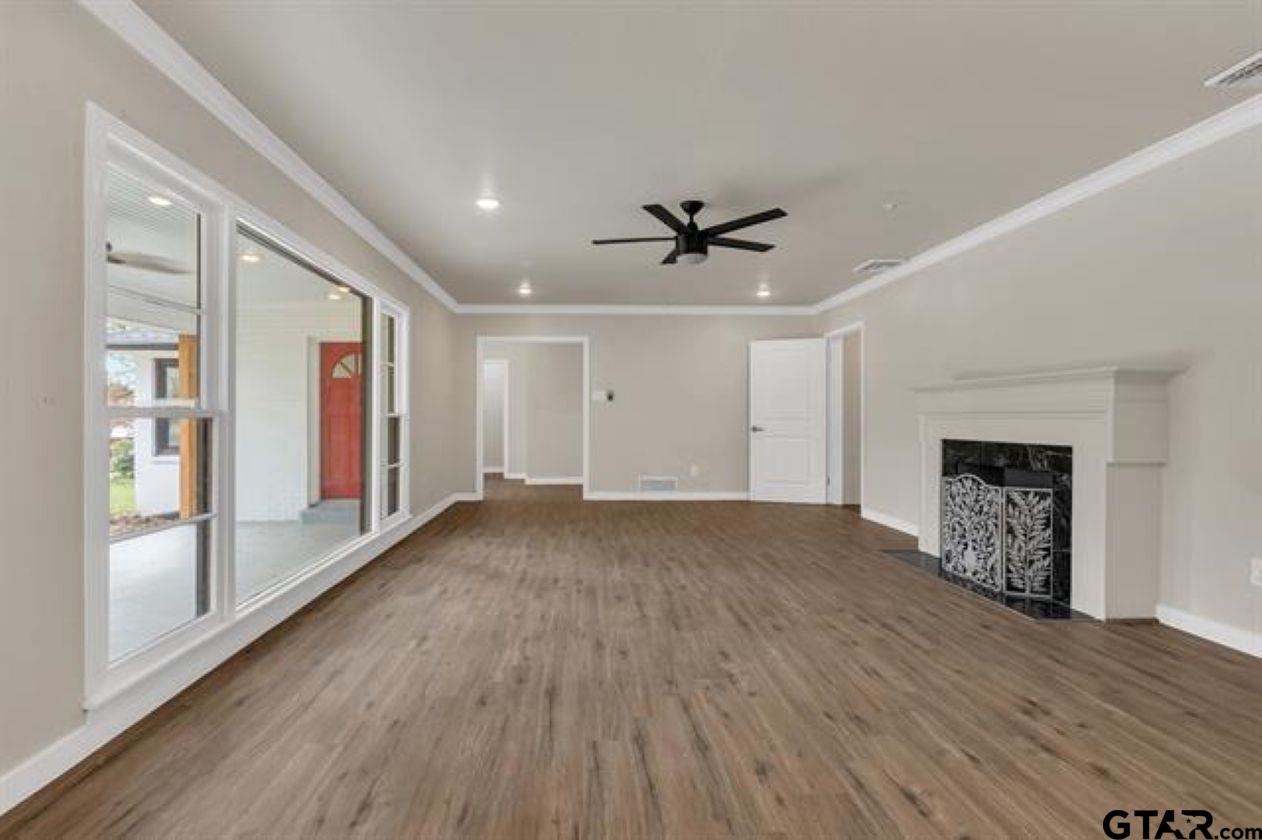 2425 Oak Lane Tyler, TX 75701 - Photo 6 of 33 a view of an empty room with window and wooden floor