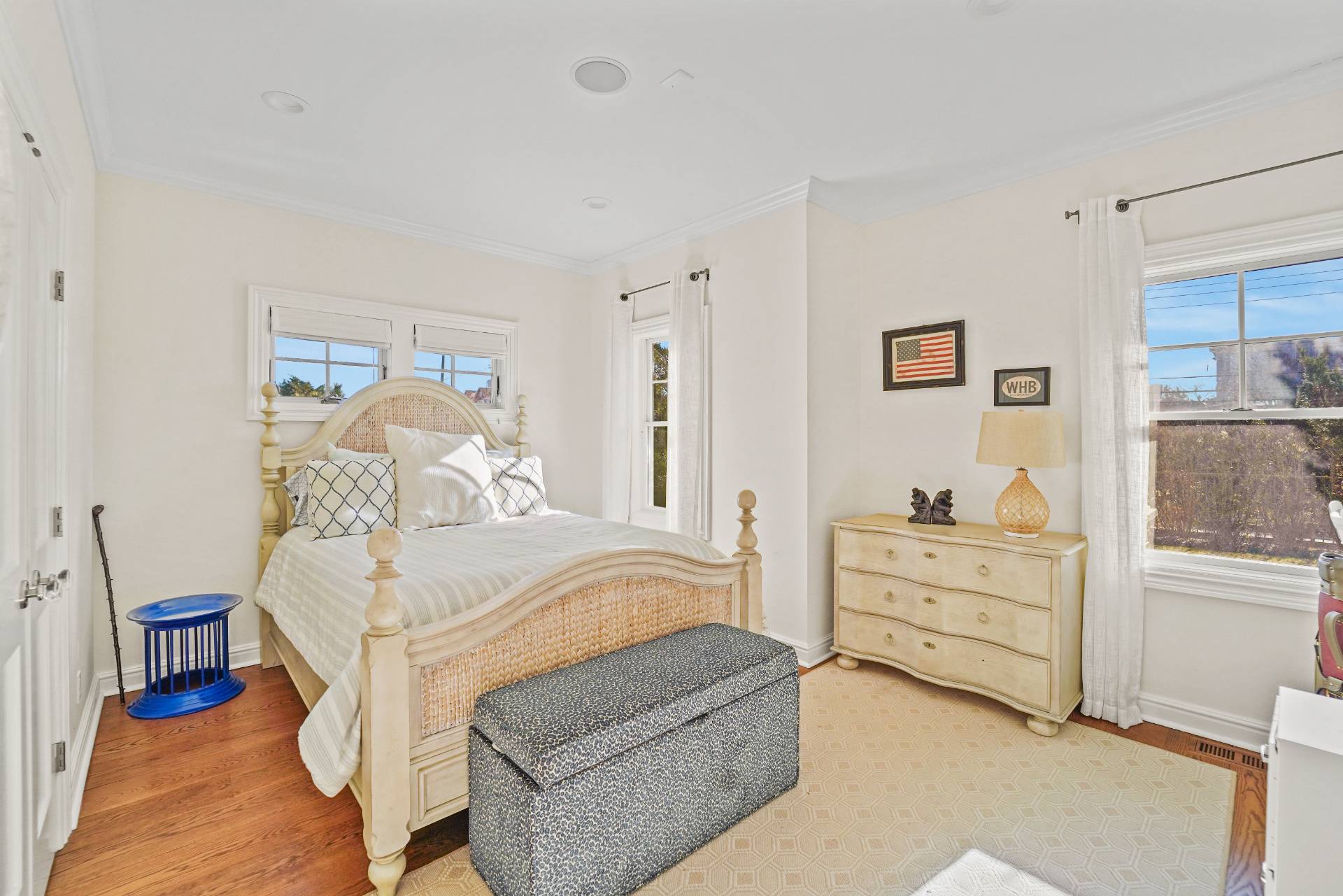 Undisclosed Address Westhampton, NY 11978 - Photo 14 of 22 a bedroom with a bed and a dresser